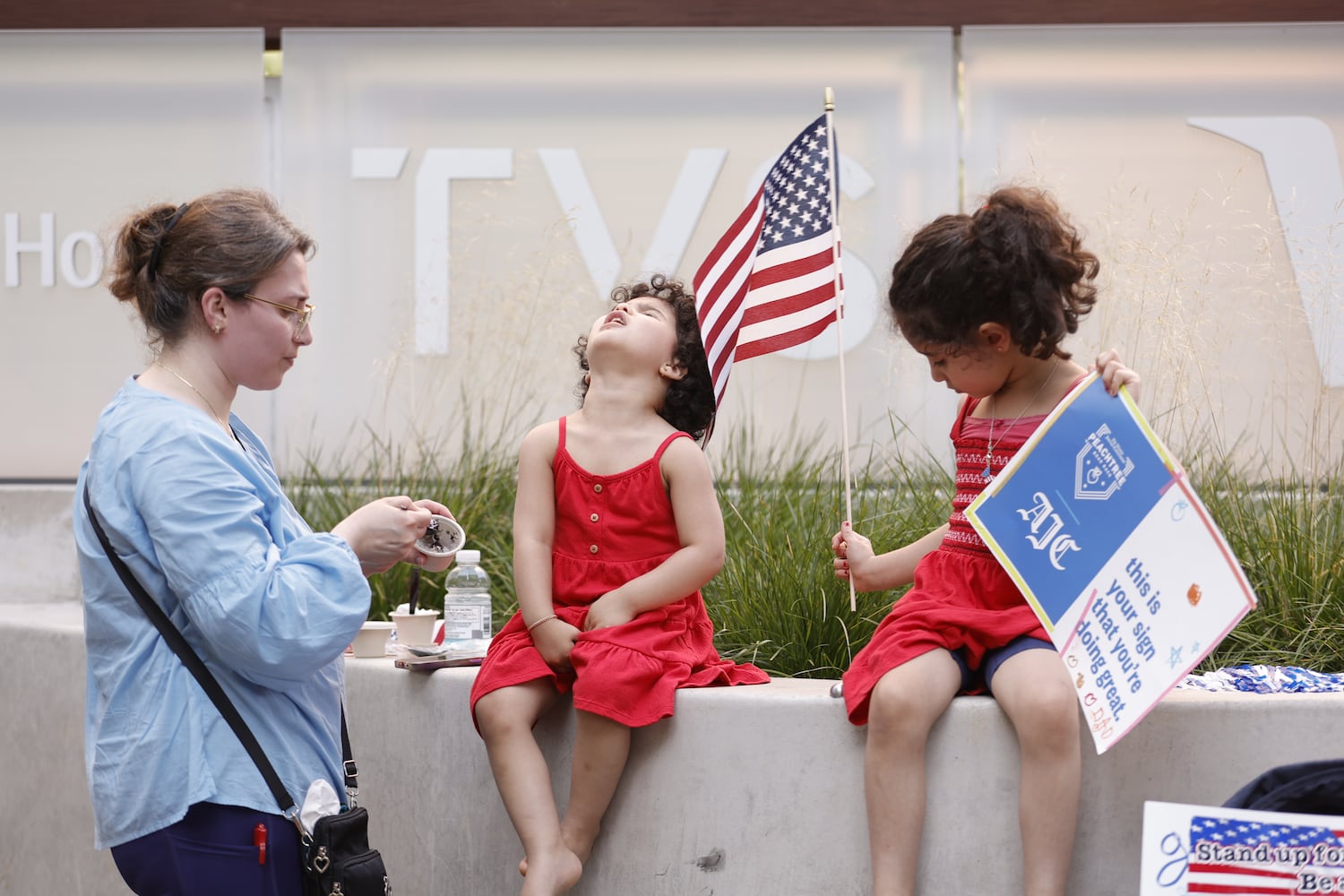 Spectators line Peachtree street at  the 56th running of the Atlanta Journal-Constitution Peachtree Road Race in Atlanta on Friday, July 4, 2025.   (Natrice Miller / AJC)