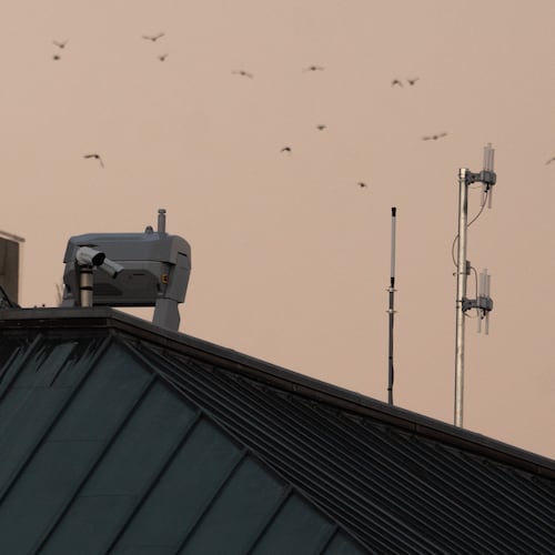 Drones stations are pictured on a federal building near the White House,Wednesday, Sept. 16, 2026, in Washington. (AP Photo/Allison Robbert)