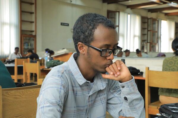 Yonas Nuguse, 21 years old, reads a book at Wemezeker National Library in Addis Ababa, Ethiopia Friday, May 30, 2025. (AP Photo/Amanuel Birhane)