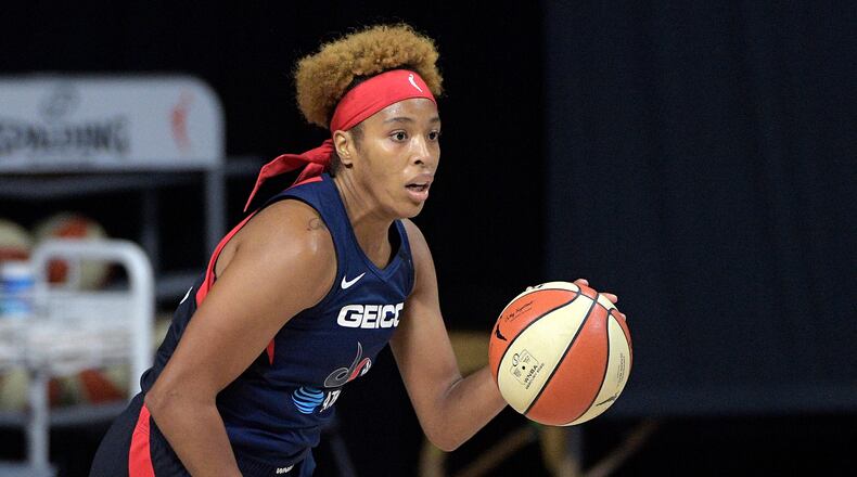 Washington Mystics forward Tianna Hawkins (21) brings the ball up the court during the first half of a WNBA basketball first round playoff game against the Phoenix Mercury, Tuesday, Sept. 15, 2020, in Bradenton, Fla. (AP Photo/Phelan M. Ebenhack)