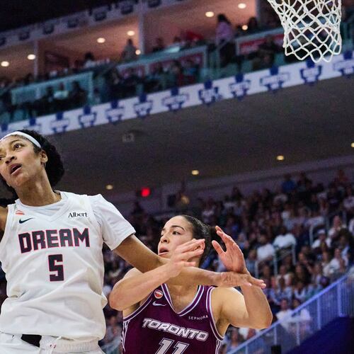Atlanta Dream's Angel Reese (5) wins a rebound against Toronto Tempo's Kia Nurse, right, during the first half of a WNBA basketball game in Toronto, Friday, July 17, 2026. (Sammy Kogan/The Canadian Press via AP)