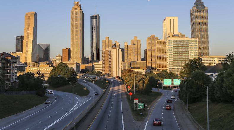 The Jackson Street Bridge Monday, Oct. 17, 2016 as the super moon set over the Atlanta skyline. The Metro Atlanta Chamber and some of its biggest corporate names plan to announce a task force Thursday to sell the region as a tech capital for the Internet of Things.. JOHN SPINK /JSPINK@AJC.COM