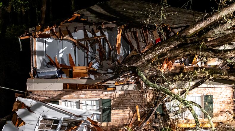 There were no injuries reported when this tree fell through the house on Brookcliff Way in DeKalb County on Thursday, April 11, 2024. After strong storms producing violent winds moved through overnight, thousands of metro Atlantans woke up in the dark Thursday. The good news is perfect weather is on the horizon. As of 9:30 a.m., Georgia Power reported about 8,500 outages in and around the city and Georgia EMCs showed just under 400 customers without power in the same area. That was down from nearly 60,000 combined outages overnight. “At times last night it almost sounded outside like a tropical storm,” Channel 2 Action News meteorologist Brian Monahan said. “Maybe that woke you up overnight — that consistent, steady, strong wind. We had some gusts up to 50, even 55 mph. That’s what brought down trees and power lines.” Atlanta weather doesn’t stay the same for long, as Atlanta will see a sun-filled weekend with highs in the mid 70s on Saturday and low 80s on Sunday perfect weather to enjoy the outdoors, especially after all the rain washed away much of the pollen. (Photo by John Spink/AJC)