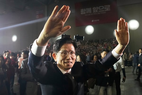 South Korea's former Labor Minister Kim Moon Soo waves as he arrives to attend the People Power Party's convention in Goyang, South Korea, Saturday, May 3, 2025. (AP Photo/Ahn Young-joon)