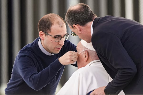 Pope Francis has a nasal cannula for oxygen adjusted as he arrives in a wheelchair at the end of a mass in St. Peter's Square at The Vatican, Sunday, April 6, 2025, part of the Jubilee of the sick and the health workers. (AP Photo/Andrew Medichini)