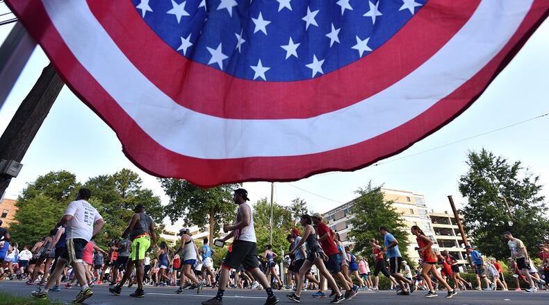 Runners approach Cardiac Hill during the AJC Peachtree Road Race on Wednesday, July 4, 2018. HYOSUB SHIN / HSHIN@AJC.COM