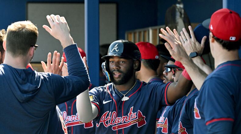 Atlanta Braves center fielder Michael Harris II celebrates with teammates after scoring during the fourth inning of a spring training baseball game at Charlotte Sports Park, Saturday, Feb. 24, 2024, in Port Charlotte, Fla. (Hyosub Shin / Hyosub.Shin@ajc.com)