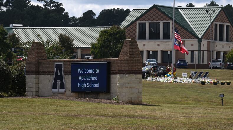 A sign is displayed outside Apalachee High School, Thursday, September 19, 2024, in Winder, about two weeks after two students and two teachers were killed in a shooting inside the school. (Hyosub Shin / AJC)