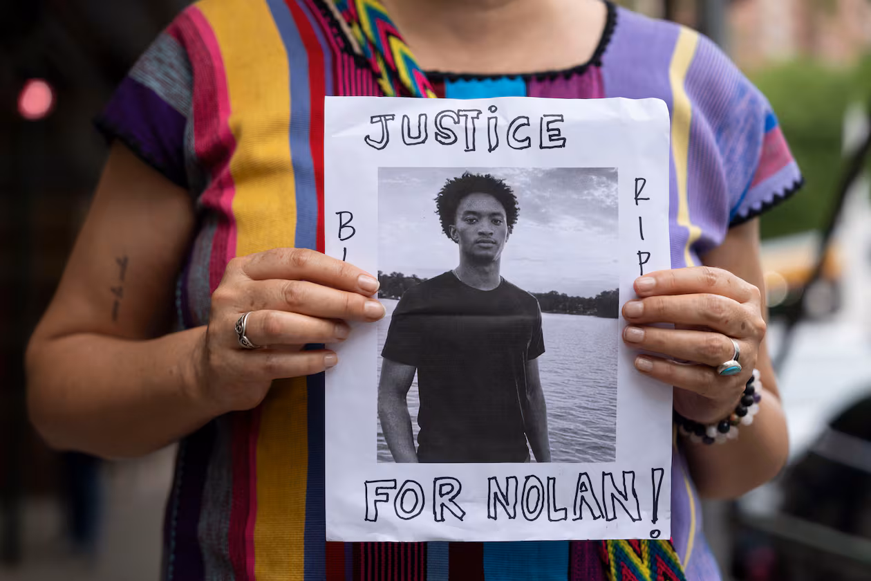 A person holds a picture of Nolan Xavier Wells during a news conference at National Action Network headquarters in New York on Friday, July 10, 2026. (Yuki Iwamura/AP)