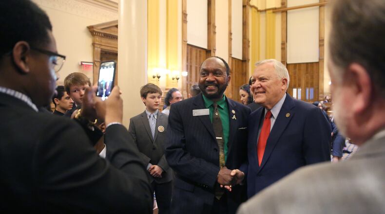 March 29, 2018 - Atlanta, Ga: Sen. Michael 'Doc' Rhett, D-Marietta, gets a photograph with Gov. Nathan Deal after Gov. Deal addressed the senate during his last Sine Die during Legislative Day 40 at the Georgia State Capitol Thursday, March 29, 2018, in Atlanta. PHOTO / JASON GETZ