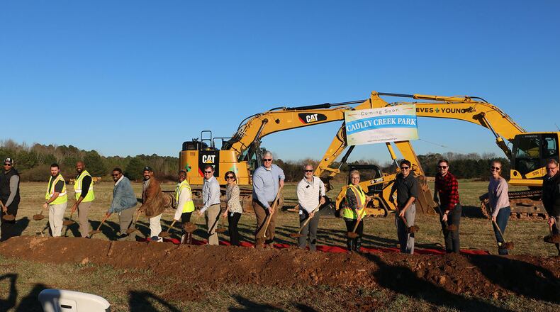 Johns Creek Mayor-elect John Bradberry, Mayor Pro Tem Lenny Zaprowski, Council members Chris Coughlin, Erin Elwood, and Stacy Skinner, Fulton County Commissioner Liz Hausmann, and members of Johns Creek’s Recreation & Parks Advisory Committee celebrate the groundbreaking for construction of the Cauley Creek Park on Bell Road. (Courtesy City of Johns Creek)