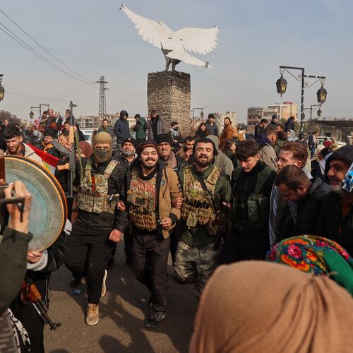 Kurdish fighters with the Syrian Democratic Forces (SDF) are cheered by local residents ahead of the end of a four-day truce with the Syrian government in Hassakeh, northeastern Syria, Saturday, Jan. 24, 2026. (AP Photo/Baderkhan Ahmad)