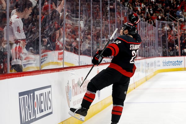 Carolina Hurricanes' Logan Stankoven (22) celebrates his goal against the New Jersey Devils during the second period of Game 1 of an NHL hockey Stanley Cup first-round playoff series in Raleigh, N.C., Sunday, April 20, 2025. (AP Photo/Karl DeBlaker)