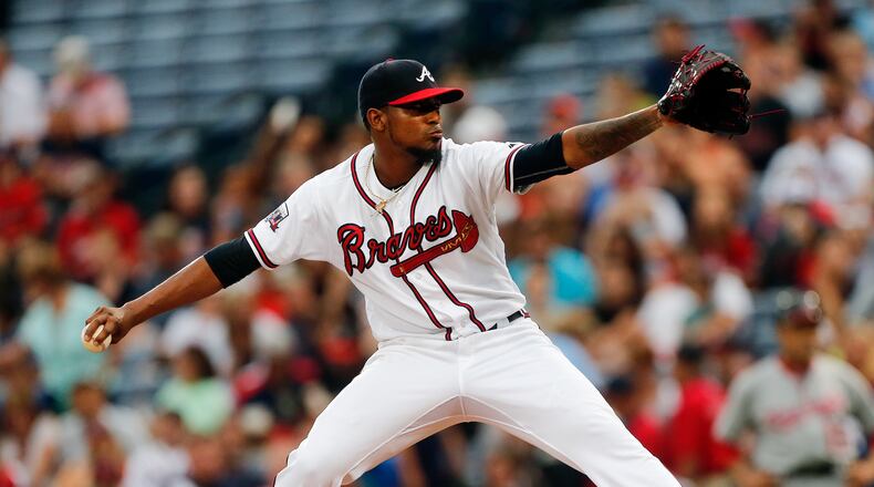 Braves starting pitcher Julio Teheran works against the Washington Nationals in the first inning of a baseball game Friday, Aug. 19, 2016, in Atlanta. (AP Photo/John Bazemore)