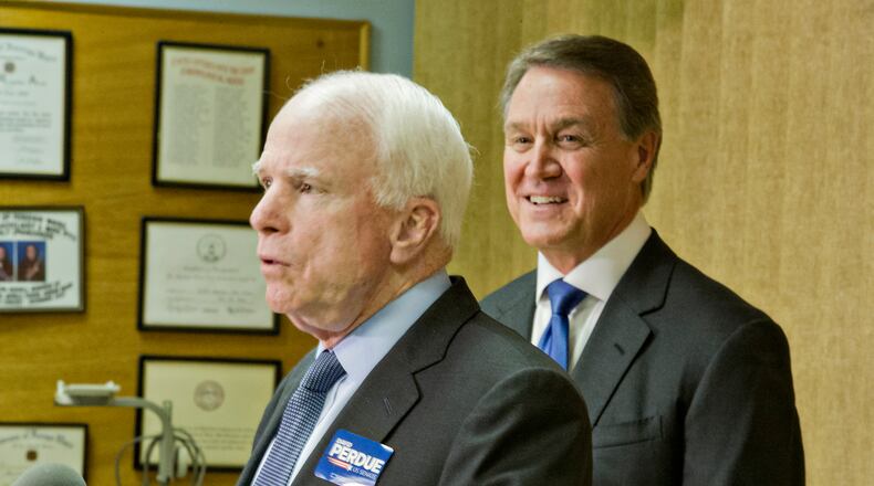 October 15, 2014 Marietta - Senator John McCain (left) and Republican candidate David Perdue answer questions by members of the media after speaking at the VFW Post 2681 in Marietta on Wednesday, Octber 15, 2014. JONATHAN PHILLIPS / SPECIAL