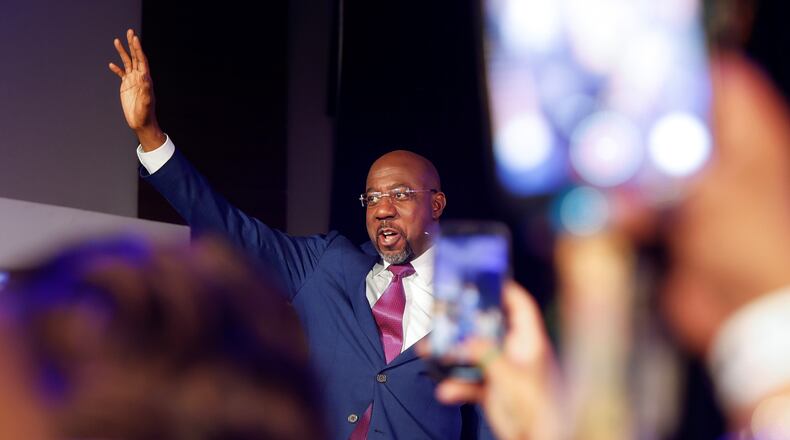 Sen. Raphael Warnock waves at supporters after winning the senate runoff election on Tuesday, December 6, 2022. (Natrice Miller/natrice.miller@ajc.com)