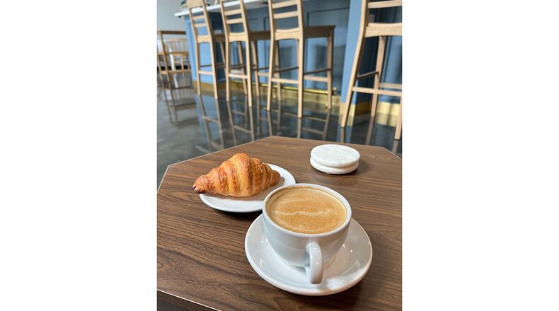 A croissant and coffee drink from the menu of Flour + Time. / Courtesy of Flour + Time