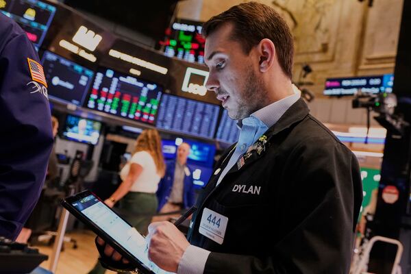 Trader Dylan Halvorsan works on the floor of the New York Stock Exchange, Wednesday, April 16, 2025. (AP Photo/Richard Drew)