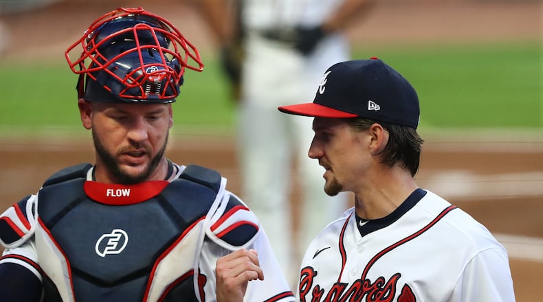 090820 Atlanta: Atlanta Braves pitcher Kyle Wright confers with catcher Tyler Flowers at the end of the second inning against the Miami Marlins in a MLB baseball game on Tuesday, Sept. 8, 2020 in Atlanta. “Curtis Compton / Curtis.Compton@ajc.com”
