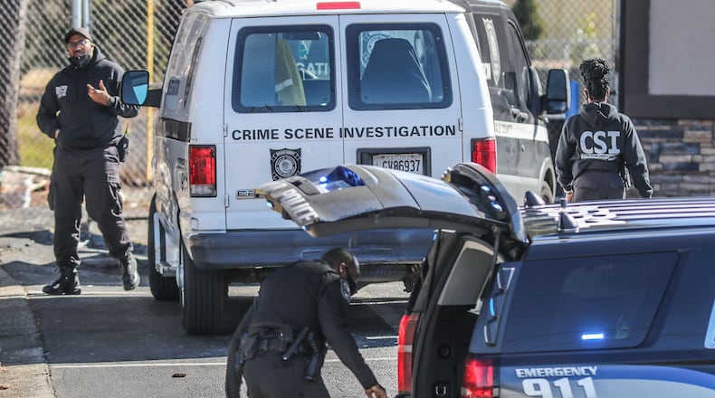 The shooting took place around 9:30 a.m. Tuesday at a Valero gas station in Stone Mountain, DeKalb County police said. (John Spink / John.Spink@ajc.com)