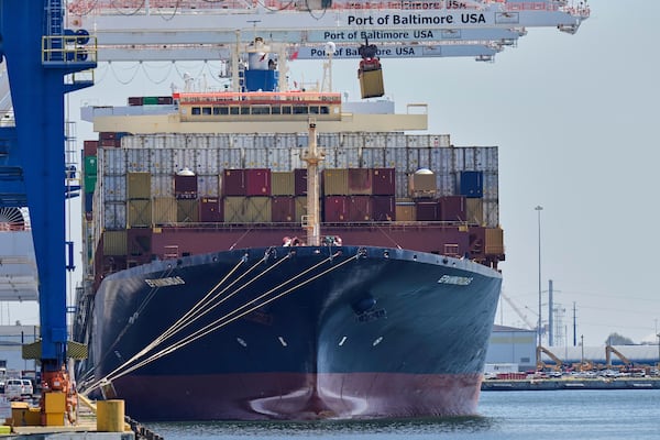 A crane lifts an imports container from the cargo ship Epaminondas while it is docked at the Port of Baltimore, Wednesday, April 9, 2025, in Baltimore. (AP Photo/Stephanie Scarbrough)