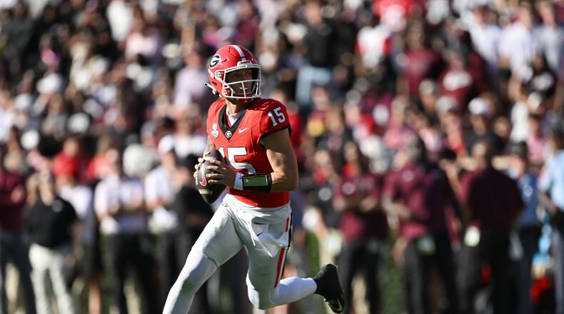 Georgia quarterback Carson Beck (15) prepares to get off a pass during the first half in an NCAA football game at Sanford Stadium, Saturday, October 12, 2024, in Athens. (Hyosub Shin / AJC)
