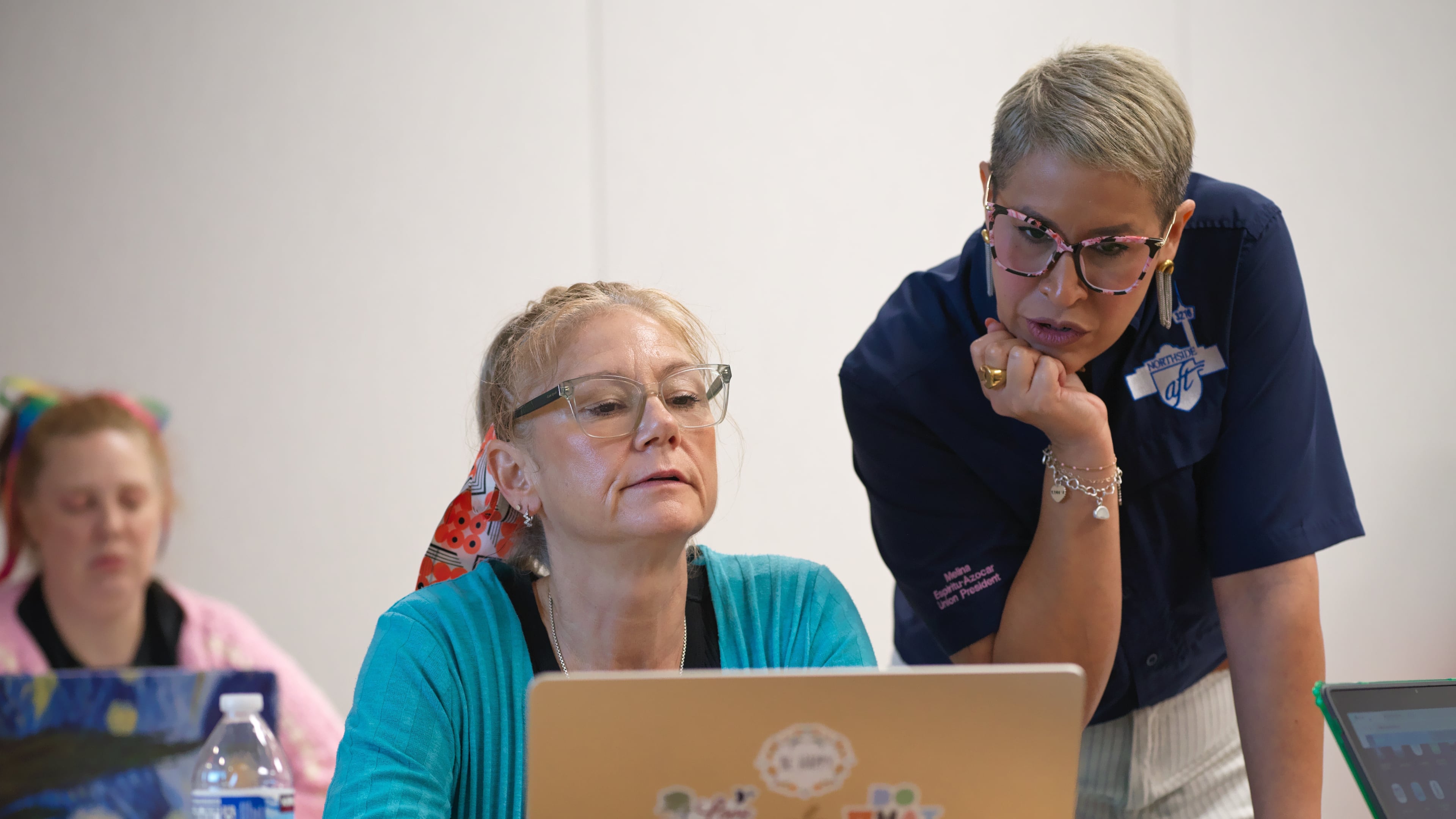 Northside American Federation of Teachers President Melina Espiritu-Azocar, right, speaks with middle school teacher Celeste Simone during a Microsoft AI skilling event, Saturday, Sept. 27, 2025, in San Antonio. (AP Photo/Darren Abate)