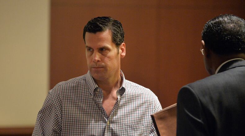 MAY 18, 2015 ATLANTA Rick Warren leaves court following the hearing. Warren, the Buckhead investor who has bought up some 10 percent of Atlanta’s English Avenue neighborhood, appears before Atlanta Municipal Court Judge Crystal Gaines, Monday, May 18, 2015. His trial was continued to May 27, over objections by the city solicitors office, due to a substitution issue with his new defense attorney, George Lawson. Warren now faces17 charges. As a habitual offender, a conviction would mean jail time. In this most recent case, code enforcement officers say he left a burnt-out house open, vacant and overgrown. He owns at least 100 properties through a half-dozen or more LLCs, many of them crumbling under his ownership. KENT D. JOHNSON /KDJOHNSON@AJC.COM