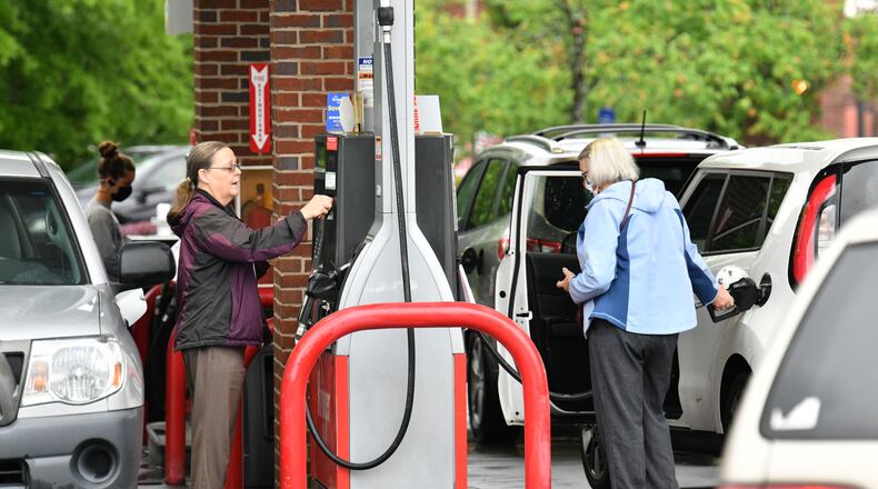 Customers wait their turn to fill up at Kroger Fuel Center in Decatur on Wednesday, May 12, 2021. Gas was one of the many things that cost more last year. Consumer prices in metro Atlanta rose 10% in 2021. (Hyosub Shin / Hyosub.Shin@ajc.com)