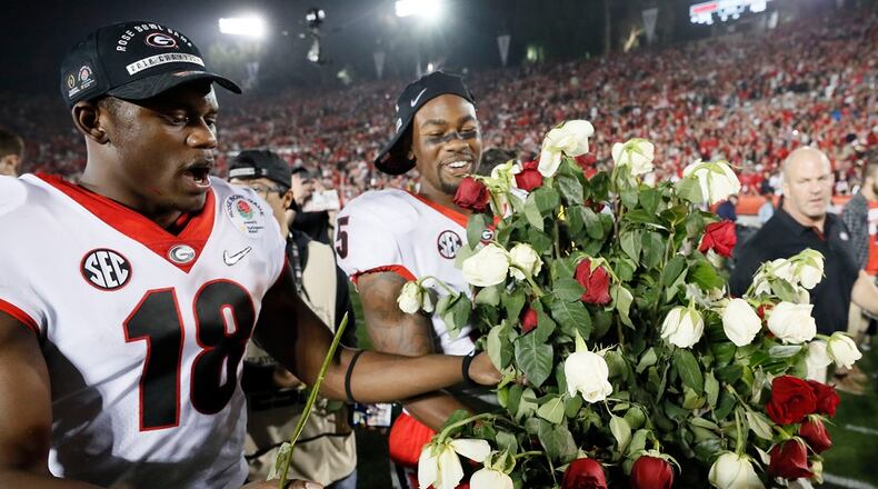 Georgia Bulldogs defensive back Deandre Baker (18) and  wide receiver Terry Godwin (5) celebrate after Georgia won the College Football Playoff semifinal at the Rose Bowl on Monday, January 1, 2018, in Pasadena. Georgia won 54-48.   BOB ANDRES  /BANDRES@AJC.COM
