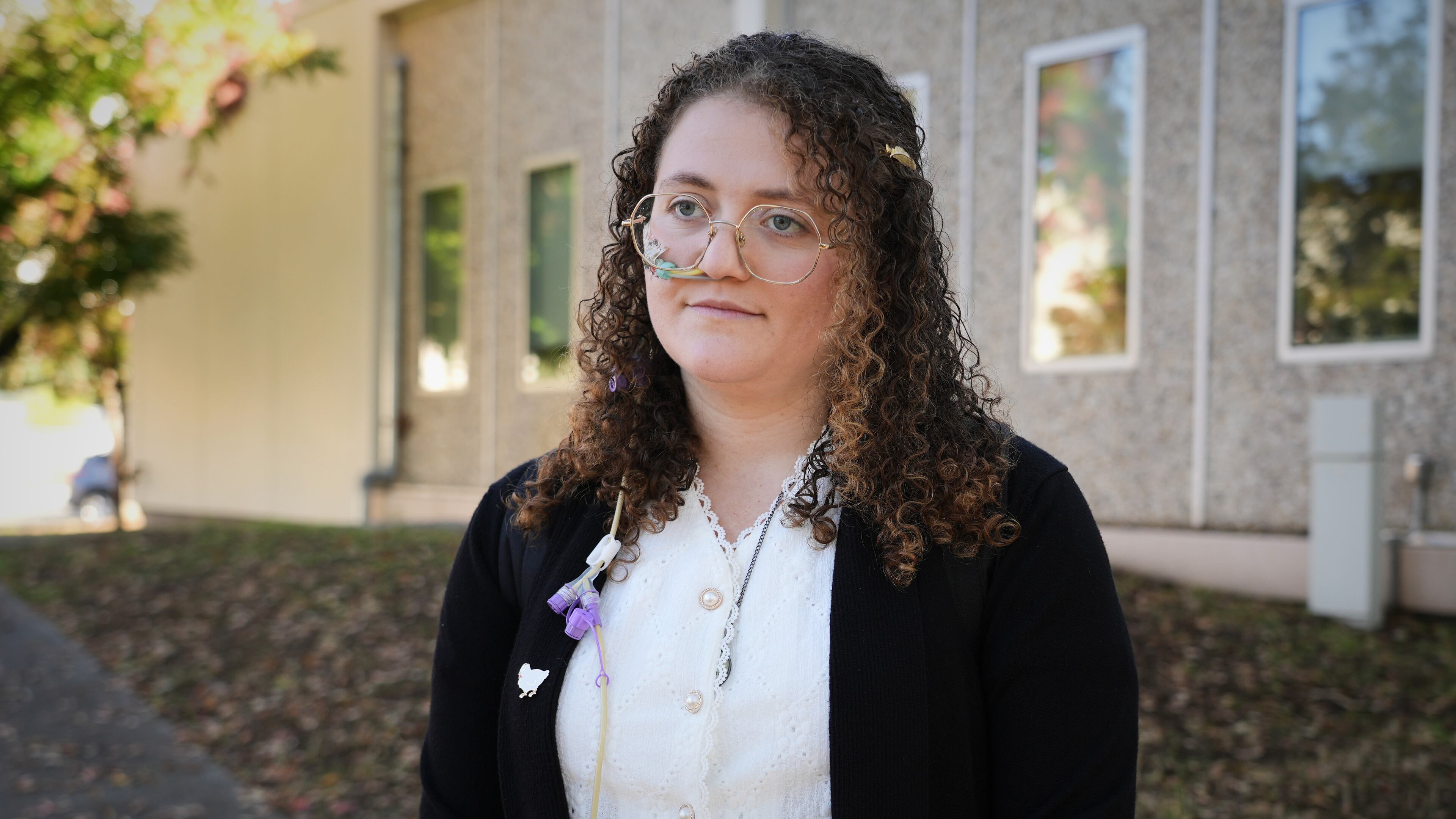 Animal rights activist Zoe Rosenberg, who is on trial for taking four chickens from one of Perdue Farms' major poultry plants, is pictured outside Sonoma County Superior Court in Santa Rosa, Calif. on Tuesday, Oct. 28, 2025. (AP Photo/Terry Chea)