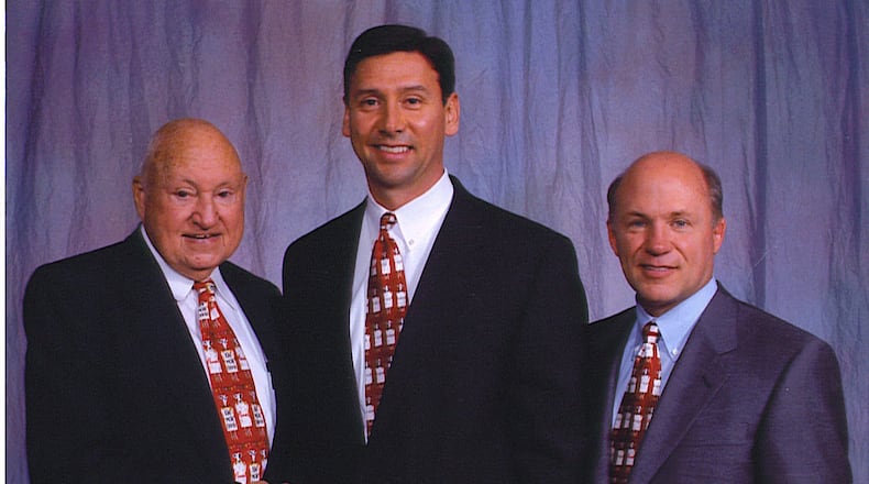 Perry McGuire with the late Truett Cathy, left, and Dan Cathy. Photo: Courtesy of Chick-fil-A