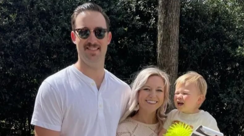 Michael Crosby is seen with his wife and child. The firefighter had multiple surgeries after he was injured in an accidental shooting at a Union City fire station May 8, officials said.