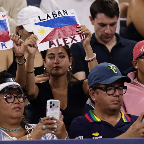 Fans of Alexandra Eala, of the Philippines, hold up signs during her match against Mary Stoiana, of the United States, in the first round of the U.S. Open tennis championships Tuesday, Sept. 1, 2026, in New York. (AP Photo/Adam Hunger)