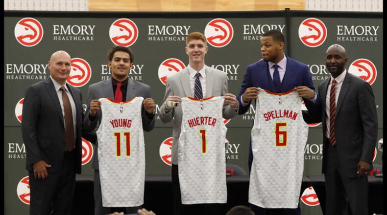 <p>
Atlanta Hawks NBA basketball team first-round draft picks, Trae Young (11), Kevin Huerter (1) and Omari Spellman (6) poses with general manager Travis Shlenk, left, and head coach Lloyd Pierce during a news conference Monday, June 25, 2018, in Atlanta.(AP photo/John Bazemore)
</p> <p>
Atlanta Hawks NBA basketball team first-round draft picks from left; Omari Spellman, Trae Young and Kevin Huerter laugh after posing for photos following a news conference Monday, June 25, 2018, in Atlanta. (AP photo/John Bazemore)
</p> <p>
Atlanta Hawks first-round draft pick Omari Spellman jokingly hugs his mother, Teresita Jones-Thomas during a photo shoot following a news conference Monday, June 25, 2018, in Atlanta.(AP photo/John Bazemore)
</p> <p>
Atlanta Hawks NBA basketball team first-round draft pick Trae Young plays with his eight-year-old brother, Timothy, after a news conference Monday, June 25, 2018, in Atlanta.(AP photo/John Bazemore)
</p> <p>
Atlanta Hawks NBA Draft first-round draft picks Trae Young (11), Kevin Huerter (1) and Omari Spellman (6) pose with their jerseys during a news conference Monday, June 25, 2018, in Atlanta.(AP photo/John Bazemore)
</p>
