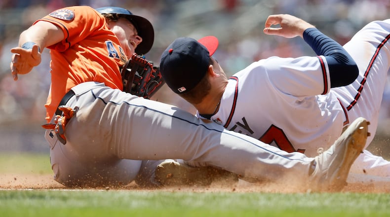 Atlanta Braves' third baseman Austin Riley tags out Houston Astros' Jake Meyers at the top of the sixth inning at Truist Park, on Sunday, Apr. 23, 2023, in Atlanta. (Miguel Martinez/The Atlanta Journal-Constitution/TNS)