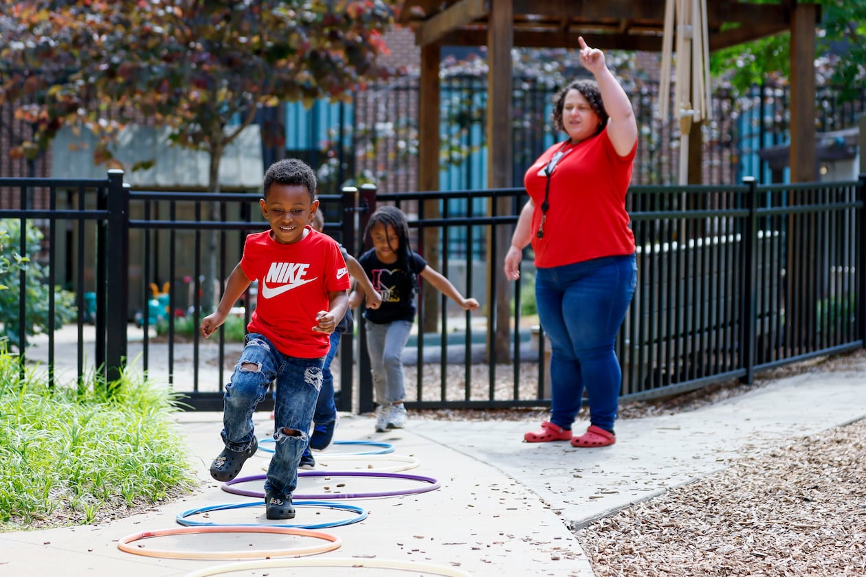 Children in the Head Start program play outside with lead teacher Genesis Lavanway at the Arthur M. Blank Early Learning Center. It's one of the Head Start programs in Georgia that may not receive its annual funding on Nov. 1 due to the ongoing government shutdown. A bridge loan from the Community Foundation for Greater Atlanta will keep the programs running for another 45 days. (Miguel Martinez/AJC)