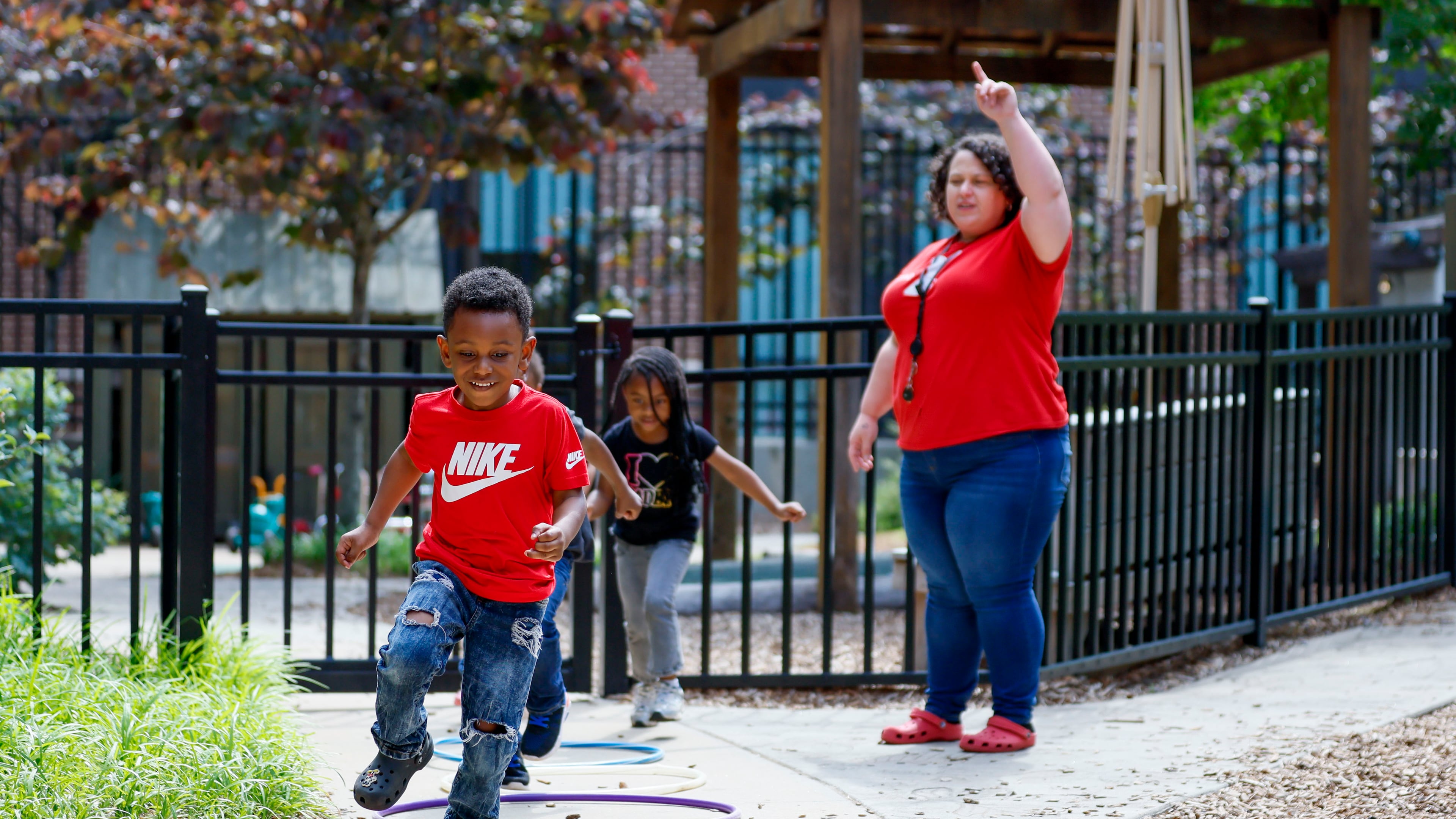 Children in the Head Start program play outside with lead teacher Genesis Lavanway at the Arthur M. Blank Early Learning Center. It's one of the Head Start programs in Georgia that may not receive its annual funding on Nov. 1 due to the ongoing government shutdown. A bridge loan from the Community Foundation for Greater Atlanta will keep the programs running for another 45 days. (Miguel Martinez/AJC)