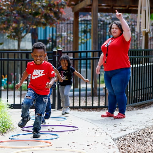 Children in the Head Start program play outside with lead teacher Genesis Lavanway at the Arthur M. Blank Early Learning Center. It's one of the Head Start programs in Georgia that may not receive its annual funding on Nov. 1 due to the ongoing government shutdown. A bridge loan from the Community Foundation for Greater Atlanta will keep the programs running for another 45 days. (Miguel Martinez/AJC)