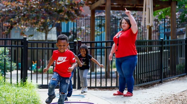 Children in the Head Start program play outside with lead teacher Genesis Lavanway at the Arthur M. Blank Early Learning Center. It's one of the Head Start programs in Georgia that may not receive its annual funding on Nov. 1 due to the ongoing government shutdown. A bridge loan from the Community Foundation for Greater Atlanta will keep the programs running for another 45 days. (Miguel Martinez/AJC)