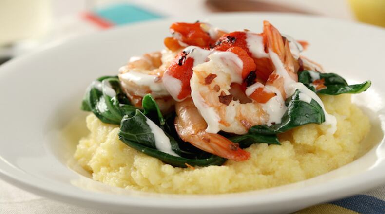 Grits with spicy collards, shrimp, roasted red peppers and aioli drizzle from Robin Asbell's "Great Bowls of Food." (Michael Tercha/Chicago Tribune/TNS)
