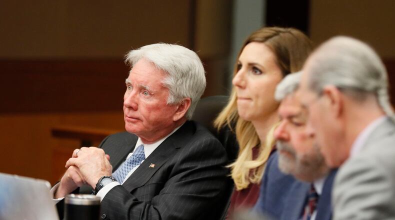 4/19/18 - Atlanta - Tex McIver, seated with his attorneys, watches the video of his police interview that the jury requested to see as they continued with their third day of deliberations today during the Tex McIver murder trial at the Fulton County Courthouse.   Bob Andres bandres@ajc.com