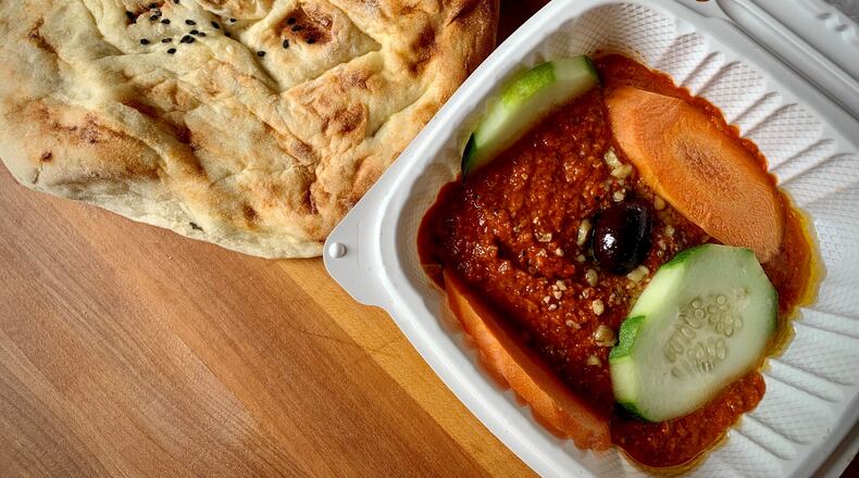 Truva's muhammara, a dip of ground walnuts and roasted red peppers, is incredibly addictive. Henri Hollis/henri.hollis@ajc.com