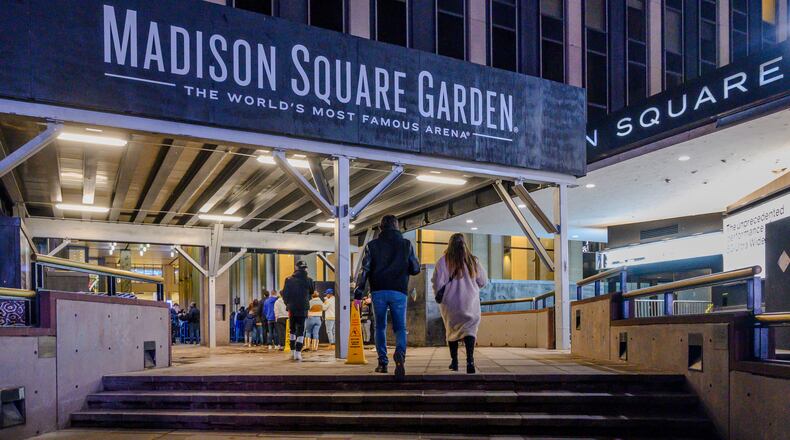 FILE - Fans line up outside Madison Square Garden before an NBA basketball game in New York, Feb. 23, 2021. (AP Photo/Brittainy Newman, File)