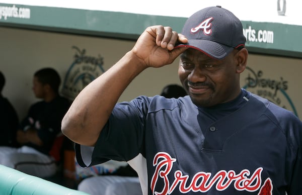 FILE - Atlanta Braves' Marquis Grissom looks at the Houston Astros dugout before the Braves play the Houston Astros in a spring training baseball game, March 23, 2008, in Lake Buena Vista, Fla. (AP Photo/Tony Dejak, File)