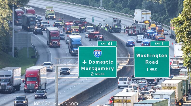 A crash caused heavy delays on I-285 North and South early Thursday in south Fulton County. JOHN SPINK / JSPINK@AJC.COM