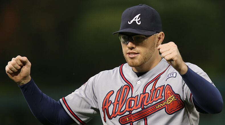 Atlanta Braves first baseman Freddie Freeman in action during a baseball game with the Philadelphia Phillies, Friday, Sept. 26, 2014, in Philadelphia. (AP Photo/Laurence Kesterson)