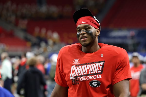 Georgia offensive lineman Devin Willock wears a Georgia SEC 2022 Champions shirt after Georgia defeated LSU 50-30 in the SEC Championship game on Dec. 3 at Mercedes-Benz Stadium. (Jason Getz / Jason.Getz@ajc.com)
