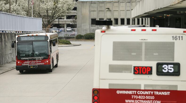 Gwinnett County Transit buses travel through the bus loading area at the Doraville MARTA Transit Station. Gwinnett is restarting some express commuter routes. (ALYSSA POINTER/ALYSSA.POINTER@AJC.COM) AJC FILE PHOTO
