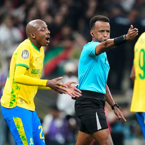 FILE - Referee Omar Artan, center, signals a penalty during the CAF Champions League final soccer match between AS FAR Rabat and Mamelodi Sundowns, in Rabat, Morocco, Sunday, May 24, 2026. (AP Photo/Mosa'ab Elshamy, File)